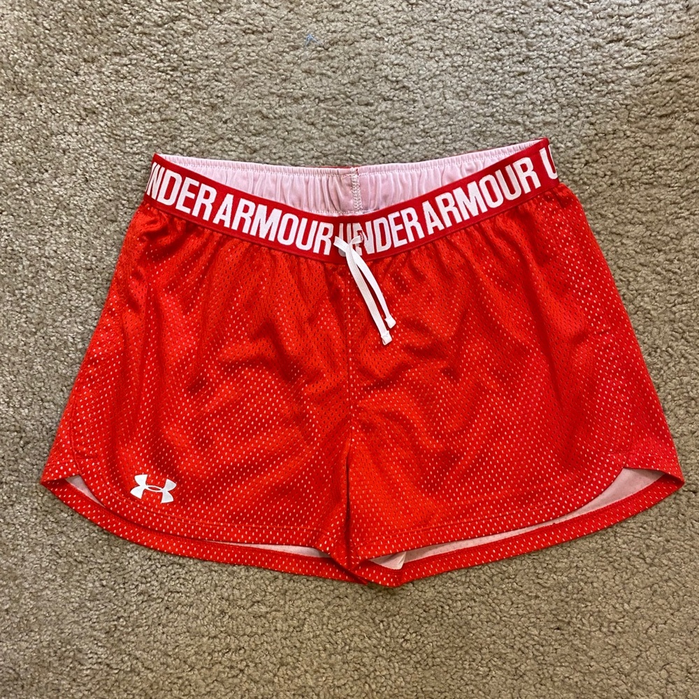 Red athletic shorts.